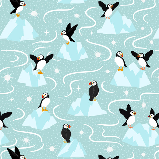 A repeating winter pattern featuring puffin birds, icy blue mountains, and white wavy lines on a light aqua background.